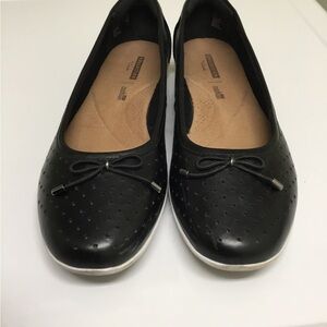 Black leather shoes by Clark